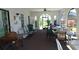 Enclosed patio with multiple tables and chairs for dining or lounging at 4412 Spicewood Dr # D, Bradenton, FL 34208