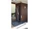 Outdoor storage unit features wood paneling and louvered door at 4412 Spicewood Dr # D, Bradenton, FL 34208