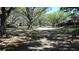 Community street lined with lush, mature trees and well-maintained landscaping at 4412 Spicewood Dr # D, Bradenton, FL 34208