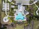 Aerial view of community pool area with lounge chairs, tables and landscaping at 4721 Tortona Ct, Bradenton, FL 34211