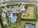 Stunning aerial view of community amenities, including pool, cabana, gardens, and parking at 4721 Tortona Ct, Bradenton, FL 34211