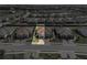 Aerial view of a home with tile roof, well-manicured lawn, and paver driveway in a beautiful community at 4721 Tortona Ct, Bradenton, FL 34211