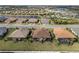 Overhead view of real estate showing an manicured backyard, screened patio, and landscaping at 4721 Tortona Ct, Bradenton, FL 34211