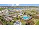 Community aerial view showcasing the pool, gardens, and surrounding homes at 4721 Tortona Ct, Bradenton, FL 34211