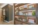 Attractive wooden display cabinet with built-in lighting and decorative items, adding sophistication to the interior at 4721 Tortona Ct, Bradenton, FL 34211