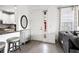 Bright entryway showcasing a white door, modern decor, and a glimpse of the kitchen and living area at 4721 Tortona Ct, Bradenton, FL 34211