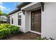 Inviting home entrance featuring a modern brown front door, brick pathway, and well-maintained landscaping at 4721 Tortona Ct, Bradenton, FL 34211