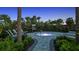 Intimate hot tub area surrounded by lush landscaping with a charming seating and privacy at 4721 Tortona Ct, Bradenton, FL 34211