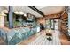 Well-lit interior showcasing a modern counter with tile accents, stainless steel appliances, and dining area at 4721 Tortona Ct, Bradenton, FL 34211
