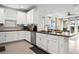 Bright kitchen with white cabinetry, granite countertops, stainless steel appliances, and an open layout at 4721 Tortona Ct, Bradenton, FL 34211