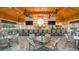 Outdoor patio bar with seating, lighting, and views of the golf course at 4721 Tortona Ct, Bradenton, FL 34211
