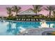Beautiful pool area with the Bahama Bar in the background, perfect for relaxing evenings and gatherings at 4721 Tortona Ct, Bradenton, FL 34211