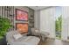 Serene relaxation room with comfortable loungers, stylish wall art, and calming natural light at 4721 Tortona Ct, Bradenton, FL 34211