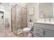 Bathroom featuring glass walk-in shower, tiled walls, bright lighting, and sleek fixtures at 4813 Sparkling Sea Ln, Lakewood Ranch, FL 34211