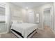 Neutral bedroom with a bed with a white comforter and a large window at 4813 Sparkling Sea Ln, Lakewood Ranch, FL 34211