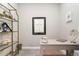Functional home office with a desk, decor, and shelving for storage and display at 4813 Sparkling Sea Ln, Lakewood Ranch, FL 34211