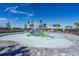 A community splash pad with colorful water features and palm trees in the background at 4813 Sparkling Sea Ln, Lakewood Ranch, FL 34211