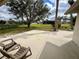 A backyard patio with lawn chairs and trees beyond at 503 Philodendron, Punta Gorda, FL 33955