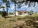 Landscaped backyard featuring a comfortable patio area ideal for outdoor entertaining and relaxation at 503 Philodendron, Punta Gorda, FL 33955