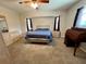 Spacious bedroom featuring neutral walls, carpet floors, ceiling fan, and complementing dressers at 503 Philodendron, Punta Gorda, FL 33955