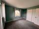 A cozy bedroom is painted in pastel colors with a matching closet and carpet at 503 Philodendron, Punta Gorda, FL 33955