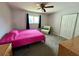Bedroom with a ceiling fan, large window, and matching wood dresser at 503 Philodendron, Punta Gorda, FL 33955