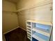 Walk-in closet with white wire shelving and bonus shelf unit at 503 Philodendron, Punta Gorda, FL 33955