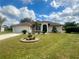 Charming single-story home with a well-manicured lawn and inviting front entrance at 503 Philodendron, Punta Gorda, FL 33955