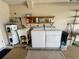 Garage setup with washer and dryer plus cleaning equipment and a sink at 503 Philodendron, Punta Gorda, FL 33955