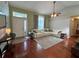 Cozy living room featuring hardwood floors and a large sectional sofa at 503 Philodendron, Punta Gorda, FL 33955