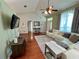 Open living room featuring hardwood floors, vaulted ceilings, and views of the front entry at 503 Philodendron, Punta Gorda, FL 33955
