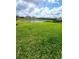 Expansive backyard featuring a tranquil pond view, perfect for relaxation and enjoying nature at 5313 Halewood Ct, Bradenton, FL 34211
