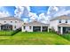 Spacious backyard features a covered patio and secure black fence, perfect for outdoor entertaining at 5313 Halewood Ct, Bradenton, FL 34211