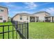 Exterior backyard view featuring a well-maintained lawn and perimeter fencing at 5313 Halewood Ct, Bradenton, FL 34211