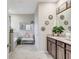 Bright bathroom with dual sinks, granite countertops, and elegant decor, enhanced by natural light and a relaxing soaking tub at 5313 Halewood Ct, Bradenton, FL 34211