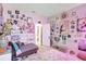 Charming bedroom with a chaise lounge, pink walls, and eclectic decor creating a cozy, personalized space at 5313 Halewood Ct, Bradenton, FL 34211