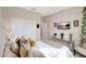 Comfortable bedroom with a large window, TV, and decorative pillows at 5313 Halewood Ct, Bradenton, FL 34211