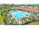 Resort-style community pool with lounge chairs, cabanas, and lush landscaping at 5313 Halewood Ct, Bradenton, FL 34211