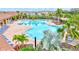 A serene community pool is surrounded by lush landscaping and comfortable lounge chairs at 5313 Halewood Ct, Bradenton, FL 34211