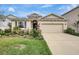 Charming home with a well-maintained lawn, stone accents and a two-car garage at 5313 Halewood Ct, Bradenton, FL 34211