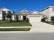 Charming single-story home with a two-car garage, lovely landscaping and stone accents at 5313 Halewood Ct, Bradenton, FL 34211