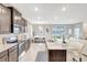 Stylish kitchen with granite countertops, stainless steel appliances, and an adjacent dining area, perfect for Gathering meals at 5313 Halewood Ct, Bradenton, FL 34211