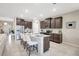 Spacious kitchen with a central island, stainless steel appliances, and ample storage space at 5313 Halewood Ct, Bradenton, FL 34211
