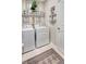 Functional laundry area with a rug, shelving, and neutral color scheme at 5313 Halewood Ct, Bradenton, FL 34211
