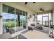 Inviting covered patio with comfortable seating and stylish decor, perfect for outdoor relaxation and entertaining at 5313 Halewood Ct, Bradenton, FL 34211