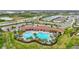 A gorgeous community pool with plenty of seating, a clubhouse, and manicured grounds create a resort-like ambiance at 5313 Halewood Ct, Bradenton, FL 34211