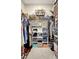 Spacious walk-in closet with shelving, hanging space, and storage accessories, offering ample organization for wardrobe and belongings at 5313 Halewood Ct, Bradenton, FL 34211