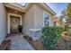 Inviting front entrance featuring a decorative wreath, stylish stonework, and a well-maintained walkway at 5333 Charlie Brown Ln, Sarasota, FL 34233