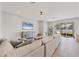 Inviting living area with plush seating, neutral decor, and sliding glass doors that lead to an outdoor patio at 5333 Charlie Brown Ln, Sarasota, FL 34233