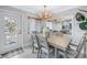 Inviting dining room with stylish furnishings, elegant lighting, and seamless access to the outdoors at 5892 17Th W St # C25, Bradenton, FL 34207